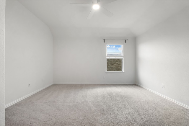 carpeted empty room with lofted ceiling and ceiling fan