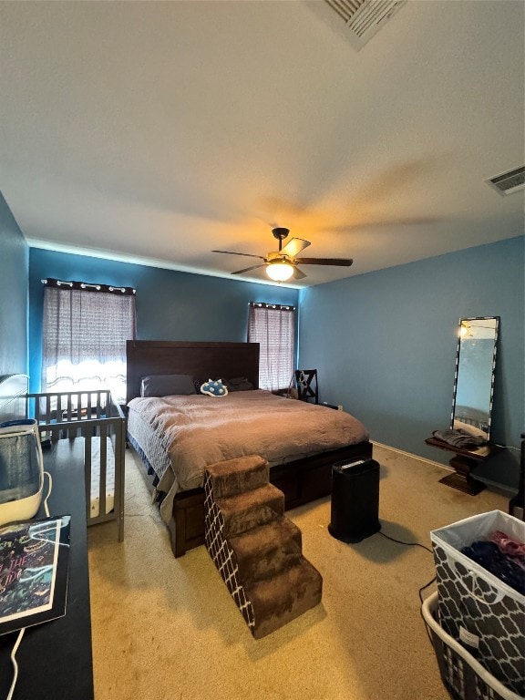 carpeted bedroom with ceiling fan