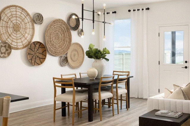 dining space with wood-type flooring