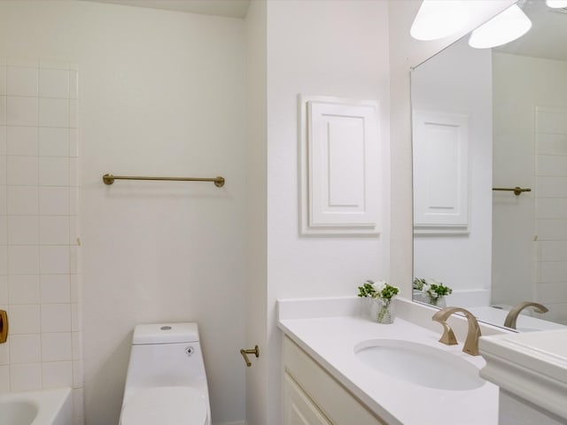 bathroom with toilet and vanity