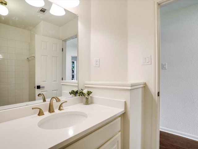 bathroom featuring wood-type flooring and vanity