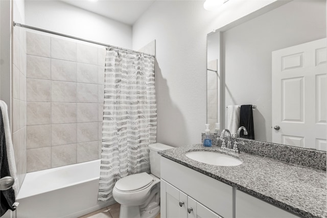 full bathroom with toilet, vanity, and shower / bath combo with shower curtain