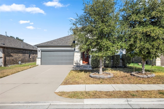 view of front of house with a front lawn and a garage