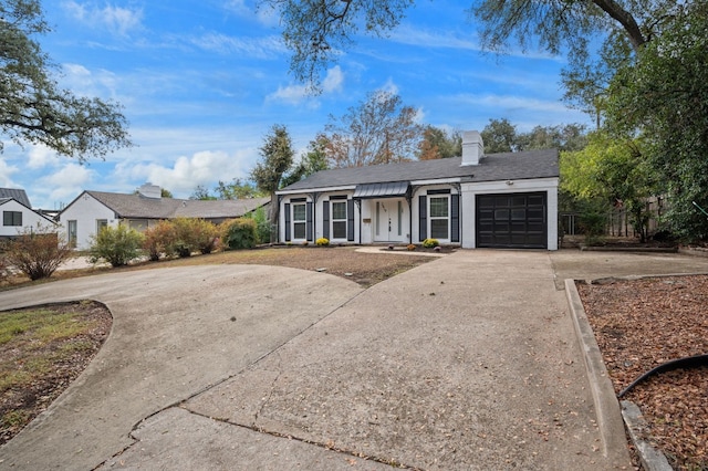 ranch-style house featuring a garage