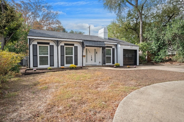 ranch-style house with a front lawn and a garage