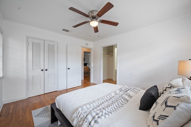 bedroom with hardwood / wood-style flooring and ceiling fan