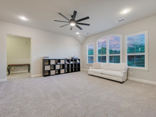 living room featuring light carpet and ceiling fan