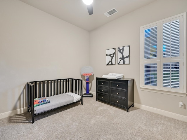 carpeted bedroom with ceiling fan