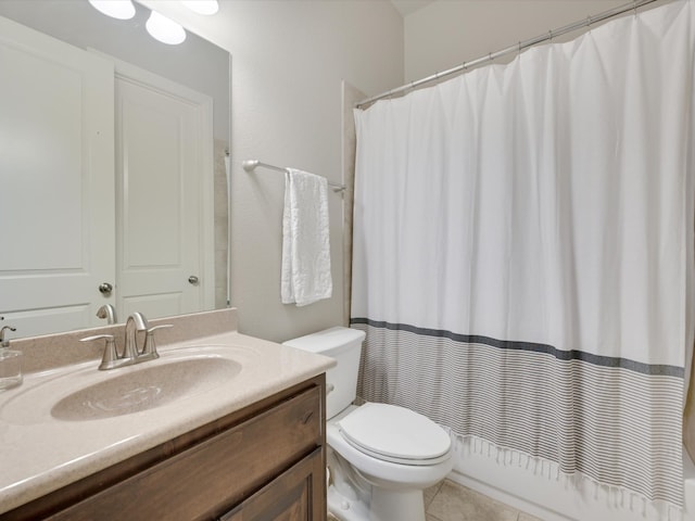 bathroom featuring toilet, a shower with curtain, vanity, and tile patterned floors