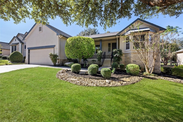 view of front of house featuring a garage, a front lawn, and covered porch