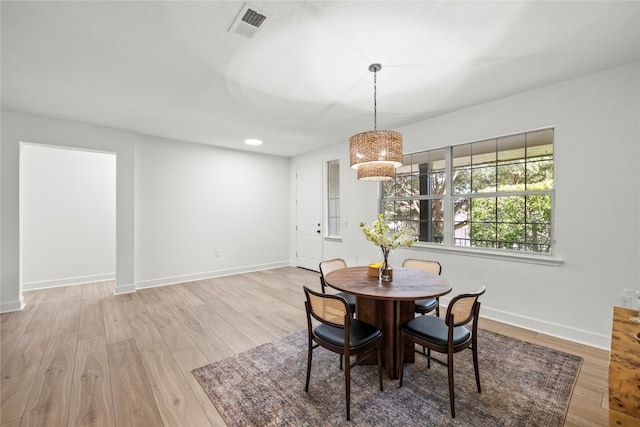 dining space featuring light hardwood / wood-style floors