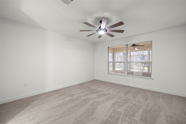 unfurnished room featuring light carpet and ceiling fan