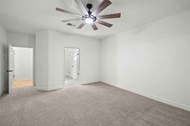 unfurnished bedroom with light carpet and ceiling fan