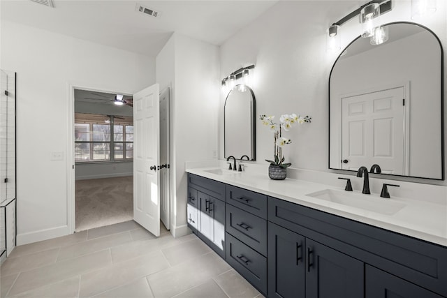 bathroom with vanity and tile patterned flooring