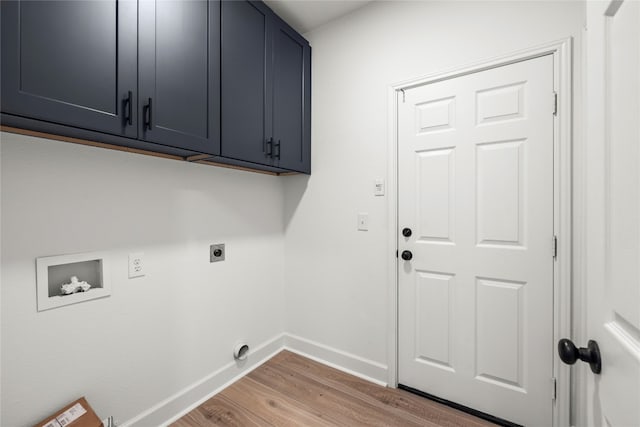 laundry area featuring cabinets, light hardwood / wood-style floors, hookup for an electric dryer, and washer hookup