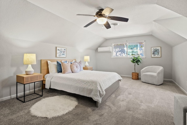 carpeted bedroom with lofted ceiling, a wall mounted air conditioner, a textured ceiling, and ceiling fan