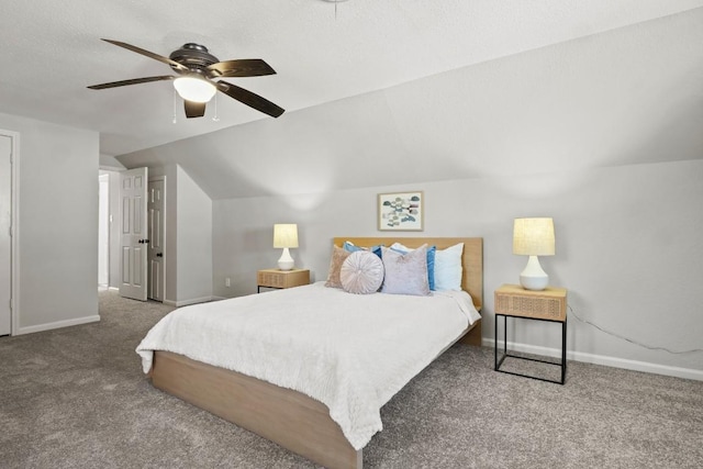 bedroom featuring a textured ceiling, carpet floors, a ceiling fan, baseboards, and vaulted ceiling