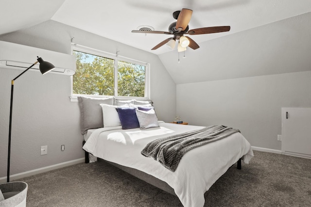 bedroom with lofted ceiling, carpet flooring, an AC wall unit, and ceiling fan