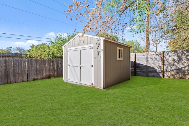 view of outbuilding featuring a lawn