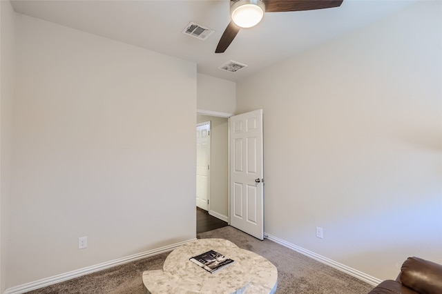 bedroom featuring dark colored carpet and ceiling fan