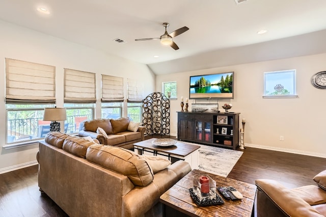 living room featuring dark hardwood / wood-style flooring, lofted ceiling, and ceiling fan