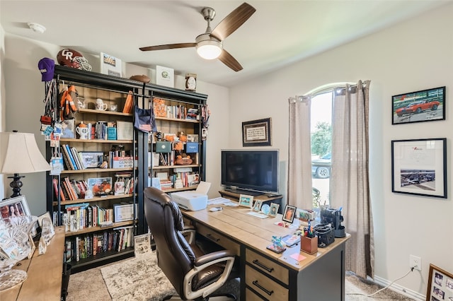 office area featuring light colored carpet and ceiling fan