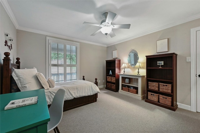 carpeted bedroom featuring ceiling fan and crown molding