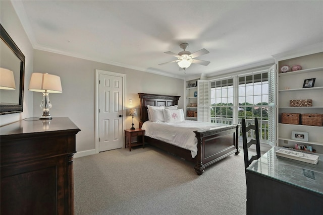 carpeted bedroom with ceiling fan and ornamental molding