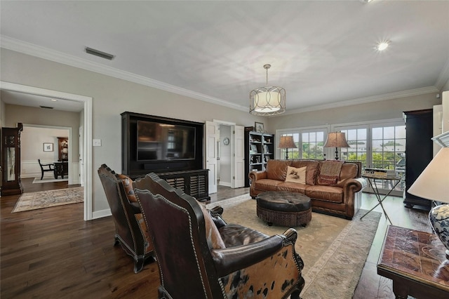 living room with hardwood / wood-style floors and crown molding