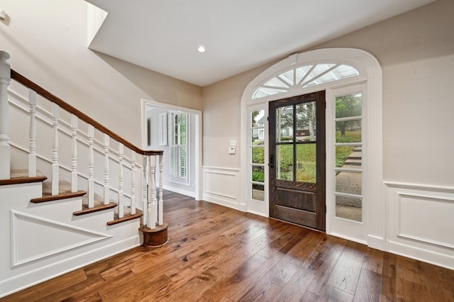 foyer entrance with plenty of natural light and dark wood-type flooring