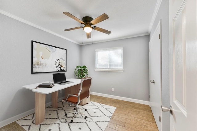 office with crown molding, baseboards, a ceiling fan, and light wood finished floors