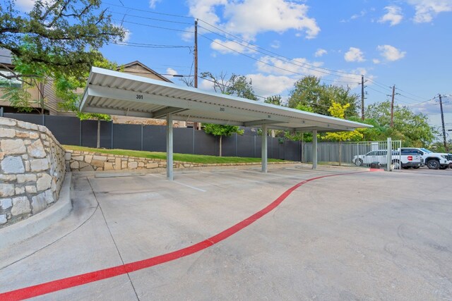 partially covered parking lot with fence