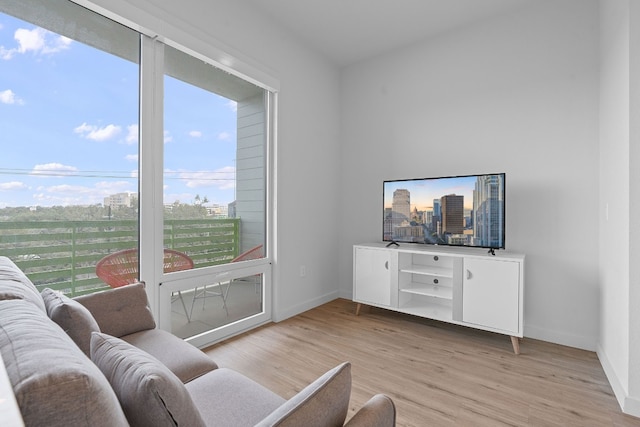 living room with light wood-style floors and baseboards