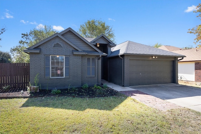 view of front of property with a garage and a front lawn