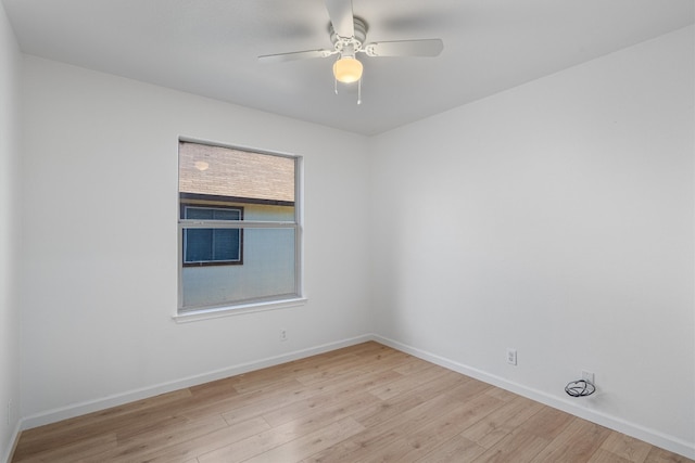 empty room featuring ceiling fan and light wood-type flooring