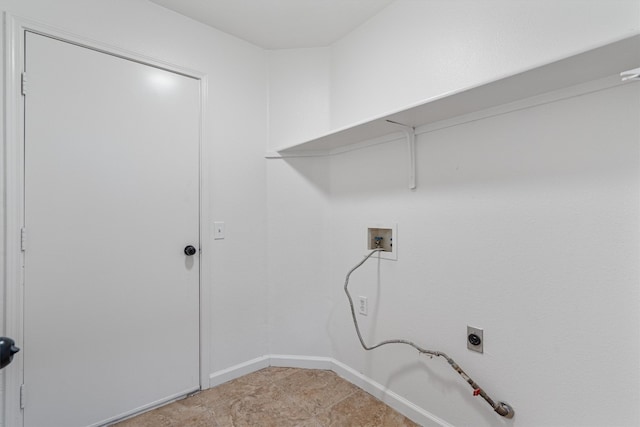 laundry area featuring gas dryer hookup, hookup for a washing machine, and light tile patterned floors