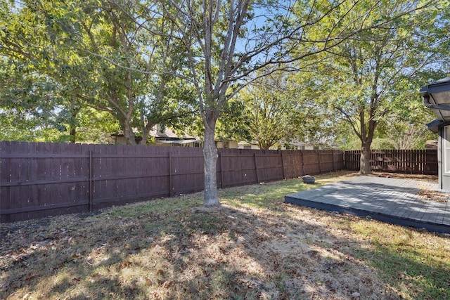 view of yard with a wooden deck