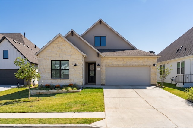 view of front of property with a garage and a front lawn