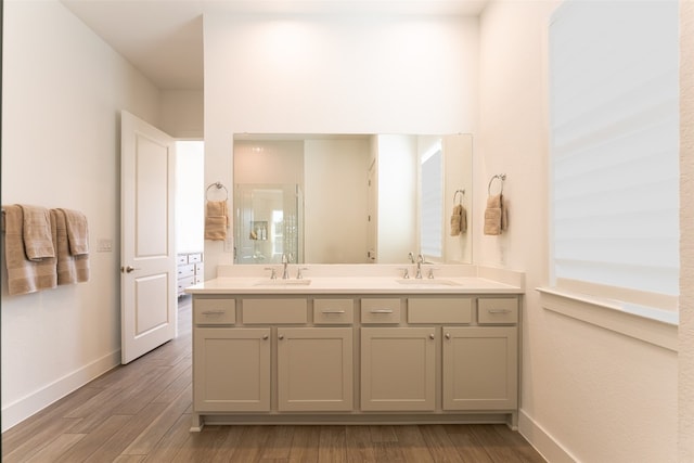 bathroom with hardwood / wood-style floors and vanity