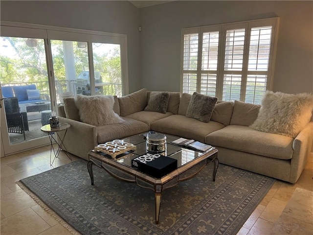 living room featuring a healthy amount of sunlight and light tile patterned flooring