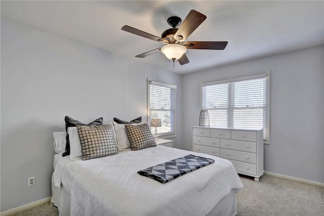 bedroom featuring ceiling fan and light carpet