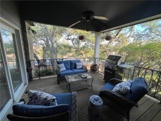 wooden terrace featuring a grill, an outdoor living space, and a ceiling fan