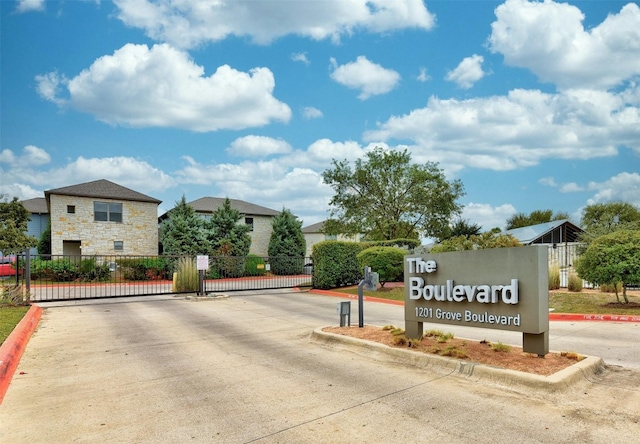 1201 Grove Blvd Unit 1501, Austin, TX 78741 - view of concrete street with curbs, a gated entry, and a gate