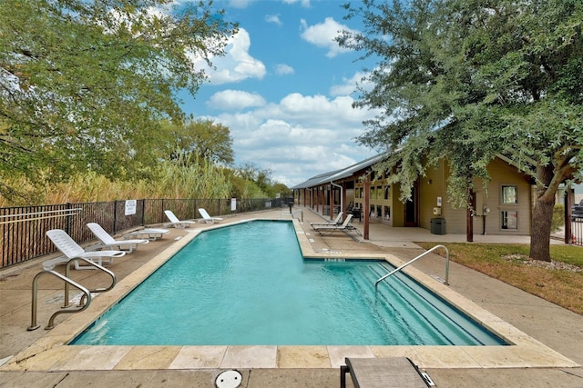 1201 Grove Blvd Unit 1501, Austin, TX 78741 - community pool featuring a patio and fence