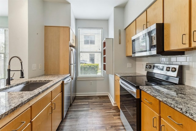 1201 Grove Blvd Unit 1501, Austin, TX 78741 - kitchen featuring stainless steel appliances, plenty of natural light, dark wood-type flooring, and backsplash