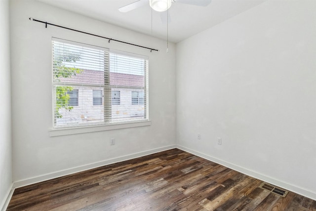 1201 Grove Blvd Unit 1501, Austin, TX 78741 - spare room featuring plenty of natural light, ceiling fan, and dark wood-style flooring