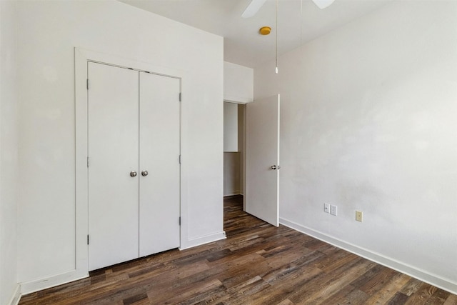 1201 Grove Blvd Unit 1501, Austin, TX 78741 - unfurnished bedroom featuring dark wood-style flooring, a closet, and a ceiling fan