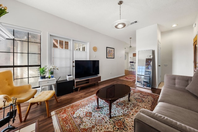 3001 Cedar St Unit 310, Austin, TX 78705 - living room featuring wood finished floors and a textured ceiling