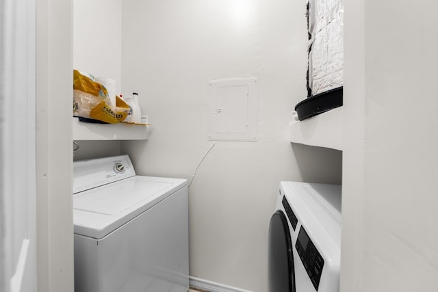 3001 Cedar St Unit 310, Austin, TX 78705 - washroom featuring electric panel and washing machine and dryer