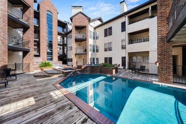 3001 Cedar St Unit 310, Austin, TX 78705 - view of swimming pool with a pool with connected hot tub